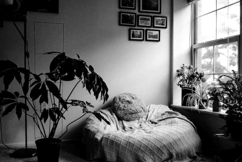 a-black-and-white-photo-of-a-person-laying-in-a-bed-ff4jstd27g